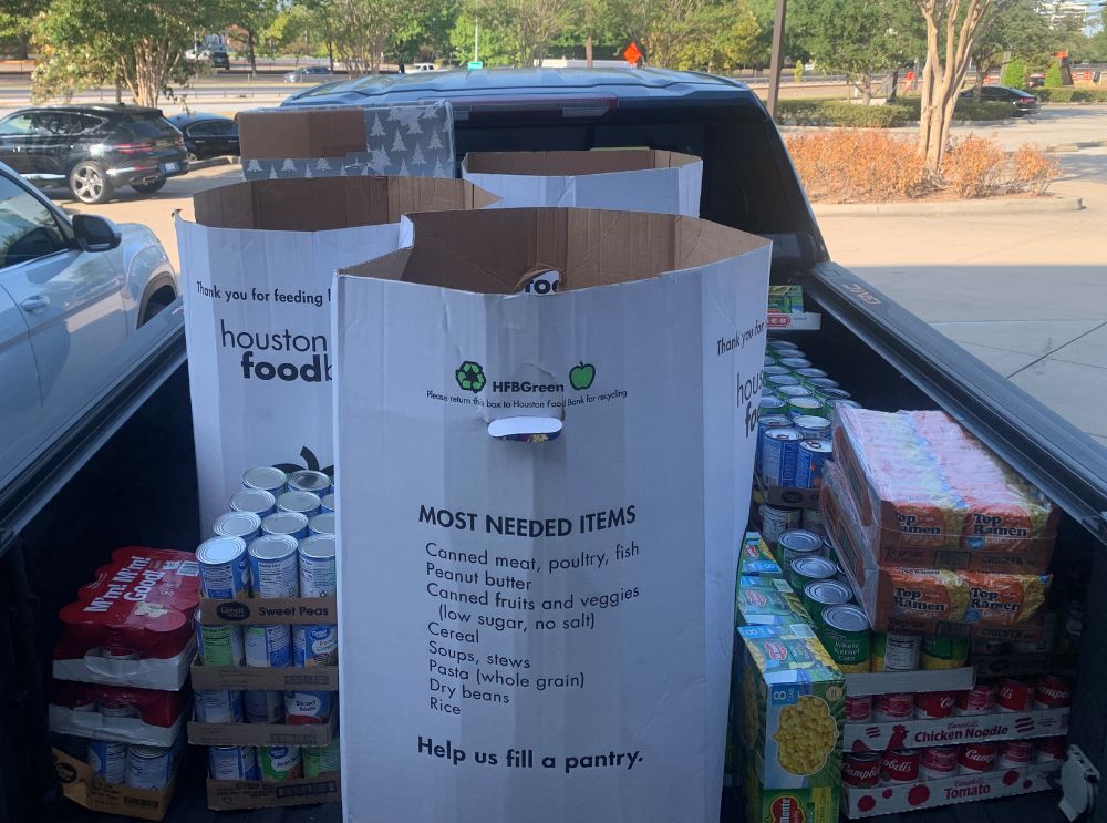 Image of truck bed filled with donated foods from Houston Police Credit Union employees for the Houston Food Bank